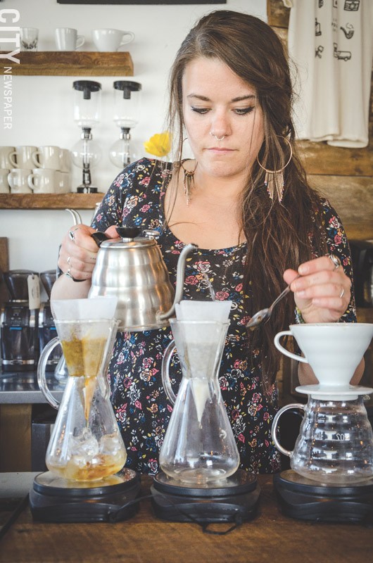 Joy Ebel brews coffee at Pour Coffee Parlor. - PHOTO BY MARK CHAMBERLIN