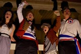 PHOTO BY JOEY CAMPAGNA, BLUE SWAN MEDIA - Emily Putnam as Eponine; Jimmy Baroom as Marius, Jonas Campagna as Gavroche; and J. Daniel Lauritzon as Enjolras in Pittsford Musicals' "Les Miserables."