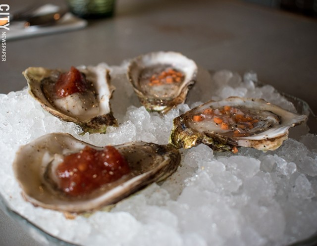 Fresh, briny oysters with zesty cocktail sauce and vinegary mignonette. - PHOTO BY JACOB WALSH