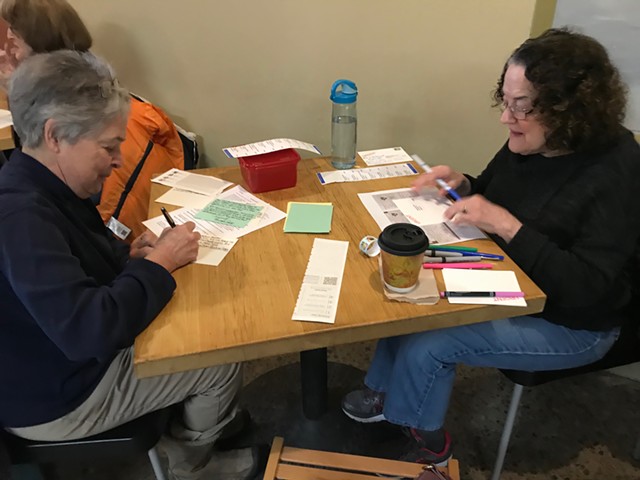 Penelope Carter, left, and Sharon Silvio, pen postcards during Postcard Fridays at Soul Coffee and Jazz at Village Gate on Friday, January 24, 2020. - PHOTO BY DAVID ANDREATTA