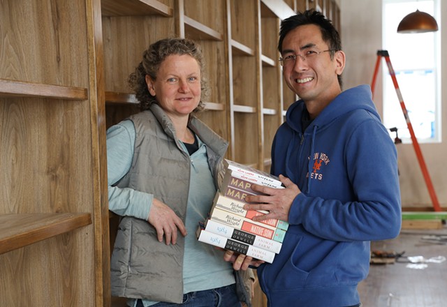 Jenny Smith and Albert Wan at Bleak House Books in Honeoye Falls. The couple is opening the bookstore after closing an English-language bookstore in Hong Kong. - PHOTO BY MAX SCHULTE