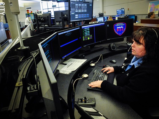 Police dispatcher Dawn LaForce handles calls at Monroe County’s 911 center, which provides dispatching services for emergency service agencies across the county. - PHOTO BY KEVIN FULLER
