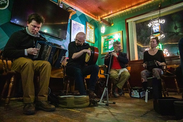 Traditional Irish musicians gather on Monday nights at Carroll's Restaurant and Bar. Pictured: John Michael Ryan on the button accordion, Sean Rosenberry on the bodhrán, Mick McQuaid on the flute, and Jenifer Hopkins on the concertina.