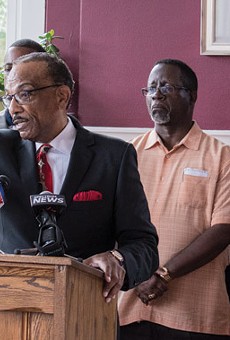 The Rev. Lewis Stewart, center, called for the release of video footage from a police body camera, following the alleged assault of a Rochester man.