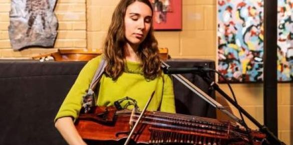 Alyssa Rodriguez playing the nyckelharpa at The Little Theatre Café.