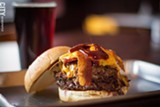 PHOTO BY KEVIN FULLER - JB's Smokehouse opened in East Rochester in June with a menu that has all the meats you'd expect from a barbecue joint. Under the burgers look for the PeJoe Burger (left), which includes grilled ham, pulled pork, bacon, sauce, and cheddar cheese.